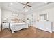 Beautiful bedroom with tray ceiling, hardwood floors, and dresser with mirror at 432 Horizon Trl, Canton, GA 30114