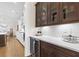 Butler's pantry with wine cooler, cabinets, and counter space between kitchen and dining room at 432 Horizon Trl, Canton, GA 30114