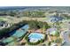 Aerial view of the luxurious community pool, tennis courts, and clubhouse nestled in lush landscaping at 432 Horizon Trl, Canton, GA 30114
