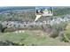 Expansive aerial view showcasing the community's golf course, residential homes and green spaces at 432 Horizon Trl, Canton, GA 30114