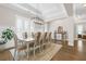 Elegant dining room with tray ceiling, chandelier, and windows with shutter, creating an airy atmosphere at 432 Horizon Trl, Canton, GA 30114