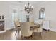 Dining area features a round wooden table with upholstered chairs and a chandelier at 432 Horizon Trl, Canton, GA 30114