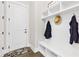 Inviting entryway featuring a bench with coat hooks and convenient built-in storage at 432 Horizon Trl, Canton, GA 30114