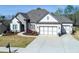 Beautiful single-Gathering home featuring a well-manicured lawn, stone accents, and a three-car garage at 432 Horizon Trl, Canton, GA 30114