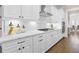 Gourmet kitchen featuring white cabinetry, stainless appliances, and elegant countertops at 432 Horizon Trl, Canton, GA 30114