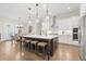 Bright, modern kitchen with a large center island, stainless steel appliances, and hardwood floors at 432 Horizon Trl, Canton, GA 30114