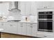 Bright kitchen with modern stainless steel appliances, white cabinets and subway tile backsplash at 432 Horizon Trl, Canton, GA 30114
