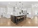 Spacious kitchen with stainless appliances, an island with seating, and hardwood floors at 432 Horizon Trl, Canton, GA 30114