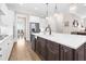 Kitchen with stainless appliances, an island with a sink and seating, and hardwood floors at 432 Horizon Trl, Canton, GA 30114