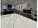 Open concept living room with fireplace, plantation shutters, and hardwood floors at 432 Horizon Trl, Canton, GA 30114