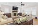 Inviting living room features a brick fireplace, hardwood floors, and windows with shutters at 432 Horizon Trl, Canton, GA 30114