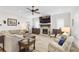 Bright living room features a brick fireplace, hardwood floors, and windows with shutters at 432 Horizon Trl, Canton, GA 30114