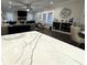 Bright living room with fireplace, large windows and view of kitchen island at 432 Horizon Trl, Canton, GA 30114