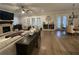 Spacious living room with brick fireplace, hardwood floors, ceiling fan, and comfortable seating arrangement at 432 Horizon Trl, Canton, GA 30114