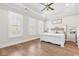 Bright main bedroom with hardwood floors, tray ceiling, and plenty of natural light at 432 Horizon Trl, Canton, GA 30114