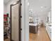 Walk in pantry with glass door, shelving and open view of kitchen and kitchen island at 432 Horizon Trl, Canton, GA 30114