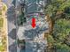 An aerial view of the roof of the home, showing multiple levels, surrounded by trees at 51 Ivy Chase Ne, Atlanta, GA 30342