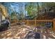 Wooden back deck with outdoor seating and wooded views at 51 Ivy Chase Ne, Atlanta, GA 30342