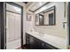 Bathroom with a black trimmed mirror, hardwood floors and a walk-in shower at 51 Ivy Chase Ne, Atlanta, GA 30342