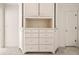 Bright bedroom featuring a built-in cabinet with drawers and open shelving at 51 Ivy Chase Ne, Atlanta, GA 30342