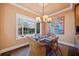 Cozy dining nook featuring a bay window with natural lighting and uniquely decorated walls at 51 Ivy Chase Ne, Atlanta, GA 30342