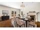 Elegant dining room with a fireplace, chandelier, and access to the outdoor deck through French doors at 51 Ivy Chase Ne, Atlanta, GA 30342