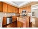 Traditional kitchen featuring custom wood cabinets, granite countertops, and stainless steel appliances at 51 Ivy Chase Ne, Atlanta, GA 30342