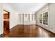 Open living room showcasing hardwood floors, built-in shelving, natural lighting, and view to the kitchen at 51 Ivy Chase Ne, Atlanta, GA 30342