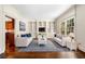 Bright living room featuring hardwood floors, built-in shelving, and an abundance of natural light at 51 Ivy Chase Ne, Atlanta, GA 30342