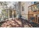 Charming brick patio with seating and access to the home and deck at 51 Ivy Chase Ne, Atlanta, GA 30342