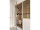 Custom tiled shower with a bench seat and hand-held shower fixture at 51 Ivy Chase Ne, Atlanta, GA 30342
