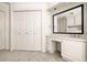 Elegant vanity area with a large mirror, drawers, and countertop space in the bedroom at 51 Ivy Chase Ne, Atlanta, GA 30342