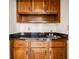 This bar has granite countertops, a sink, and wooden cabinets and drawers for storage at 51 Ivy Chase Ne, Atlanta, GA 30342