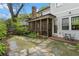 Beautiful backyard with a well-manicured garden, mature trees, a screened-in porch, and a lovely stone path at 1054 Euclid Ne Ave, Atlanta, GA 30307