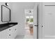 Elegant bathroom with subway tile, a sleek vanity, and a view into the bedroom at 1054 Euclid Ne Ave, Atlanta, GA 30307
