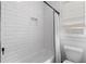 Clean bathroom tub with white subway tile surround and a window for natural light at 1054 Euclid Ne Ave, Atlanta, GA 30307