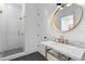 Modern bathroom with subway tile shower, glass door, gold fixtures, and marble vanity top at 1054 Euclid Ne Ave, Atlanta, GA 30307