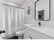 Clean bathroom with a shower tub, a white vanity, and a modern black faucet at 1054 Euclid Ne Ave, Atlanta, GA 30307