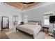 Bright bedroom with a wooden accent ceiling, ceiling fan, and neutral tones at 1054 Euclid Ne Ave, Atlanta, GA 30307