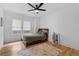 Cozy bedroom with hardwood floors, natural light, and a ceiling fan at 1054 Euclid Ne Ave, Atlanta, GA 30307