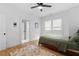 Bright bedroom features hardwood floors, ceiling fan, and a window with modern blinds at 1054 Euclid Ne Ave, Atlanta, GA 30307