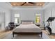 A spacious bedroom with wood flooring, a Peloton exercise bike, and a modern ceiling fan at 1054 Euclid Ne Ave, Atlanta, GA 30307
