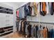 Organized walk-in closet with custom shelving and hanging space for clothes and accessories at 1054 Euclid Ne Ave, Atlanta, GA 30307