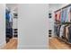 Dual walk-in closets with custom shelves and hanging rods provide ample storage at 1054 Euclid Ne Ave, Atlanta, GA 30307