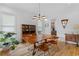 Bright dining room featuring hardwood floors, natural light, and a modern chandelier at 1054 Euclid Ne Ave, Atlanta, GA 30307