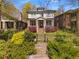 Charming two-story home with a landscaped front yard and inviting front porch at 1054 Euclid Ne Ave, Atlanta, GA 30307