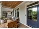 Cozy front porch featuring comfortable outdoor seating and a stylish wood ceiling at 1054 Euclid Ne Ave, Atlanta, GA 30307