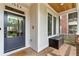 Charming front porch with a dark wood storage box and views of the neighborhood at 1054 Euclid Ne Ave, Atlanta, GA 30307