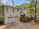 Charming two-story home with a detached garage and a paved driveway at 1054 Euclid Ne Ave, Atlanta, GA 30307