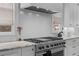 Close up of a kitchen with marble counters and stainless steel stove at 1054 Euclid Ne Ave, Atlanta, GA 30307